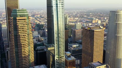 Drone-flight-between-Los-Angeles-skyscrapers-at-daytime-Aerial-circling