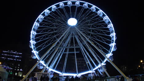 Large-iron-wheel-with-cabins-dominating-the-Moravian-Square-in-Brno-carrying-passengers-during-the-Christmas-holidays-captured-at-4k-60fps-slow-motion