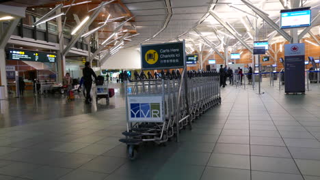 Passengers-with-luggage-inside-YVR-airport-in-Vancouver-BC-Canada-with-4k-resolution