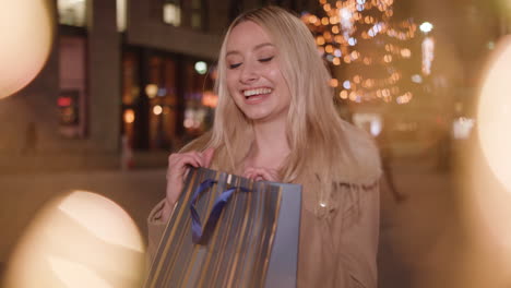 Attractive-young-lady-is-excited-about-the-present-she-is-given