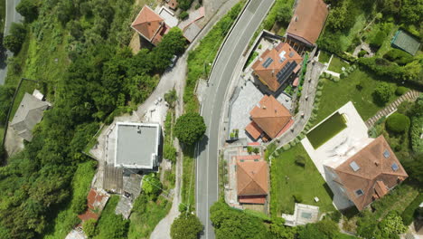 Foce-la-spezia,-italy,-showcasing-lush-greenery-and-residential-buildings,-aerial-view