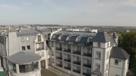 Aerial-view-of-bride-in-wedding-dress-stay-on-balcony-waiting-for-groom-in-hotel-room-or-apartment