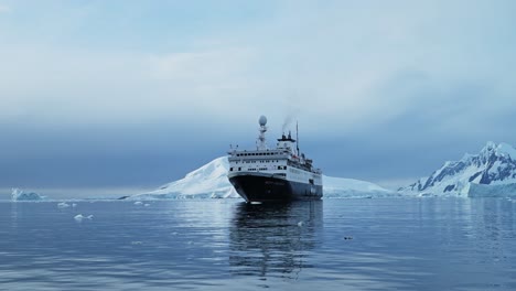 Antarctica-Ship-and-Mountains-Scenery,-Cruise-Ship-Boat-in-Beautiful-Dramatic-Amazing-Antarctic-Peninsula-Scenery-and-Winter-Landscape-on-Tourist-Travel-Vacation-and-Holiday-to-Antarctica