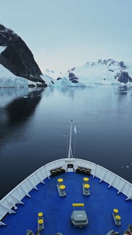 Antarctica-Cruise-Ship-Bow-of-Boat-on-Antarctic-Boat-Trip-Vacation-with-Beautiful-Amazing-Scenery-and-Winter-Landscape-with-Mountains-in-the-Southern-Ocean-Sea-in-the-Antarctica-Peninsula