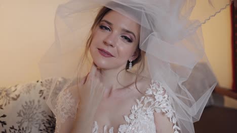 Beautiful-and-lovely-bride-in-night-gown-and-veil.-Wedding-morning.-Slow-motion