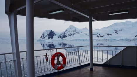 Antarctica-Ship-and-Beautiful-Scenery,-Cruise-Ship-Boat-in-Dramatic-Amazing-Antarctic-Peninsula-Mountains-Scenery-and-Winter-Landscape-on-Tourist-Travel-Vacation-and-Holiday-to-Antarctica