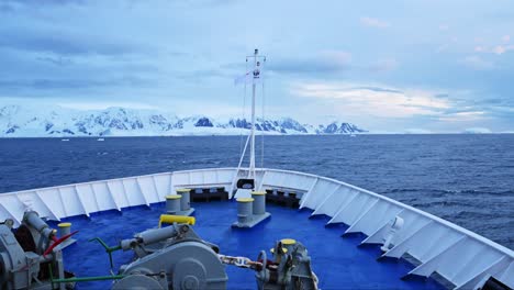 Antarctica-Ship-and-Mountains-Scenery,-Cruise-Ship-Boat-in-Beautiful-Dramatic-Amazing-Antarctic-Peninsula-Scenery-and-Winter-Landscape-on-Tourist-Travel-Vacation-and-Holiday-to-Antarctica