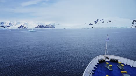 Antarctica-Ship-and-Beautiful-Scenery,-Cruise-Ship-Boat-in-Dramatic-Amazing-Antarctic-Peninsula-Mountains-Scenery-and-Winter-Landscape-on-Tourist-Travel-Vacation-and-Holiday-to-Antarctica