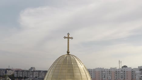 Dome-of-church,-aerial-view,-traditional-old-church-in-city-Lviv,-Ukraine,-cloudy-sky-background