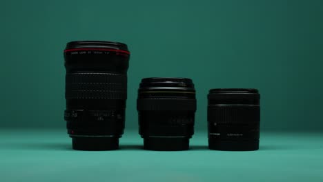 Close-up-of-camera-lenses-against-a-dramatic,-dark-background