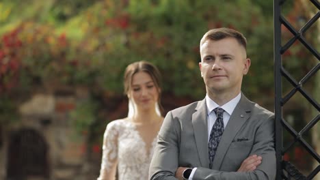 Lovely-newlyweds-caucasian-bride-embracing-groom-in-park-making-kiss,-wedding-couple-family-hugging