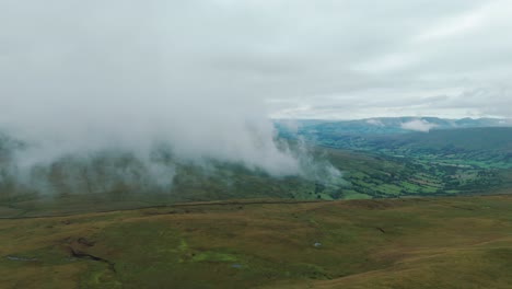 Profile-view-of-famous-Whernside-tarns-under-fog-during-daytime-in-Yorkshire-Dales,-England