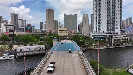 Cars-on-river-bridge-of-Miami-with-skyline-and-skyscrapers-at-daytime