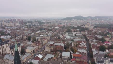 Aerial-drone-view-of-city-Lviv,-Ukraine,-flight-above-roofs-and-streets,-panorama-of-ancient-town