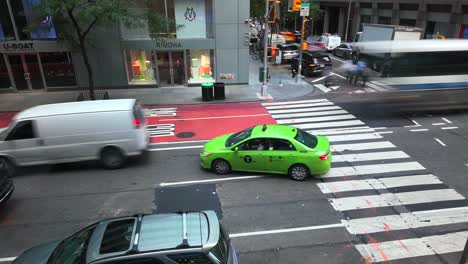 An-elevated-time-lapse-from-a-second-floor-office-window,-looking-down-at-the-busy-intersection-of-53rd-St