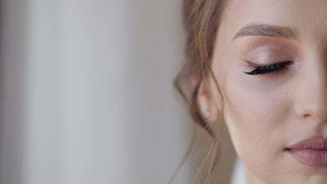 Close-up-of-beautiful-lovely-stylish-bride-girl-looking-at-camera-and-smiling,-wedding-morning