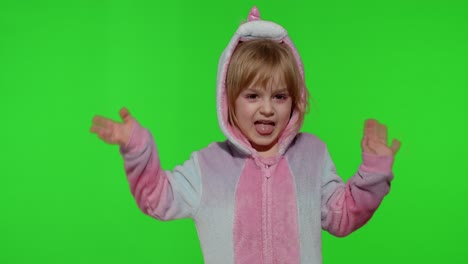 Child-girl-in-unicorn-pajamas-making-silly-funny-faces,-fooling-around,-dancing-on-chroma-key