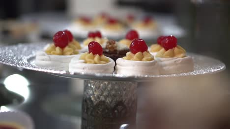 Sweet-meringue-decorated-with-confined-cherry,-wedding-dessert-course-menu