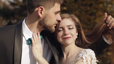 Newlyweds.-Caucasian-groom-with-bride-in-the-park.-Wedding-couple.-Happy-family