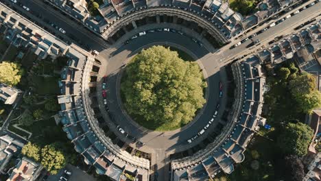 Birdseye-Rotating-View-of-Roundabout-in-Bath,-England-at-Sunset