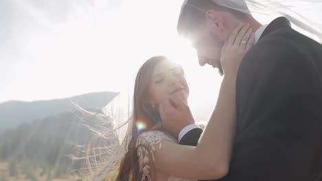 Newlyweds.-Caucasian-groom-with-bride-on-mountain-slope.-Wedding-couple.-Happy