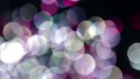 Multicolored-light-leaks-4k-footage-on-black-background.-Stylizing-video,-transitions.-Bokeh-effect