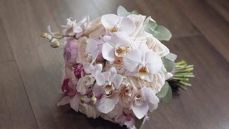 Beautiful-wedding-bouquet-on-wooden-floor