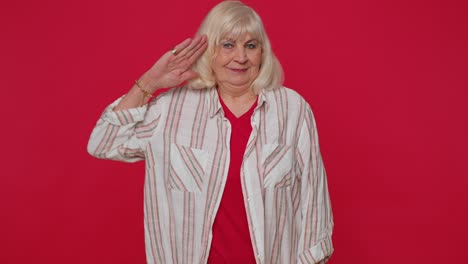 Subordinate-senior-woman-giving-salute-listening-to-order-as-if-soldier-following-discipline-obeying