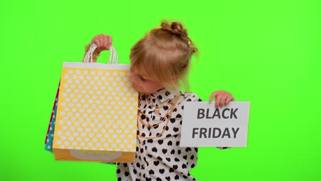 Kid-child-girl-showing-Black-Friday-banner-text,-advertising-discounts,-low-prices,-shopping