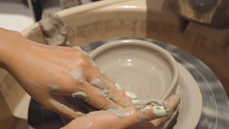 Woman-Hands-On-Workshop-In-Ceramic-Studio,-Clay-Molding-Of-A-Ceramic-Pottery