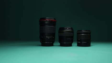 Close-up-of-camera-lenses-against-a-dramatic,-dark-background