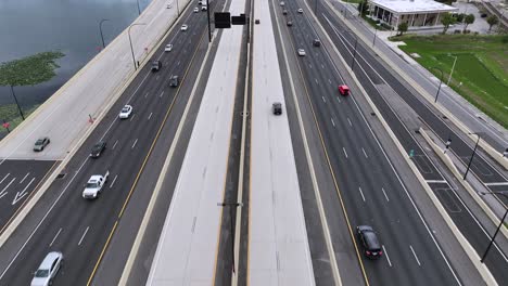 Aerial-flyover-car-traffic-interchange-road-in-evening,-drone-shot-top-down-roadway-intersection-in-Florida