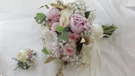 Beautiful-wedding-bouquets-lie-near-window-on-white-curtains