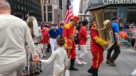 A-Chinese-marching-band-parade-shot-in-4K-in-New-York-City-during-the-early-summer-of-2024,-featuring-USA-flags