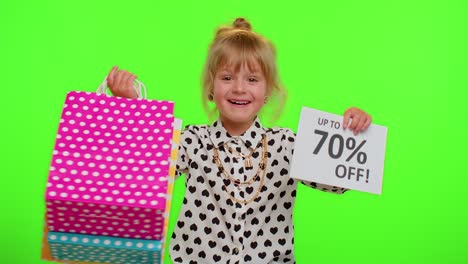 Kid-child-girl-showing-shopping-bags-and-Up-To-70-Percent-Off-inscriptions-banner-text,-Black-Friday