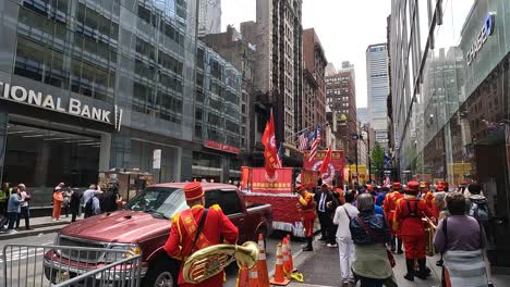 Chinese-marching-band-in-red-uniforms-preparing-for-carnival-in-New-York-City