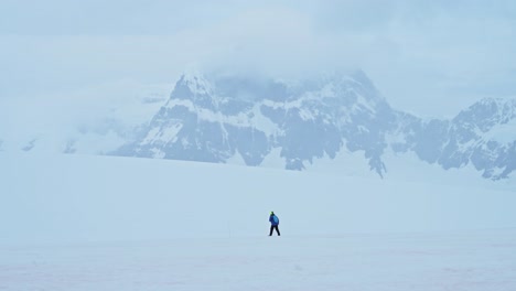 Tourist-Walking-in-Antarctica-in-Beautiful-Scenery,-Dramatic-Amazing-Antarctic-Peninsula-Scenery-and-Winter-Landscape-on-Tourist-Travel-Vacation-and-Holiday-to-Antarctica