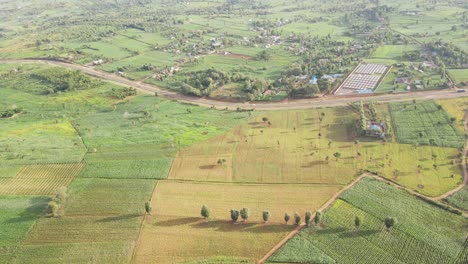 Scenic-African-countryside-with-cultivated-farms-and-modern-highway,-aerial-view