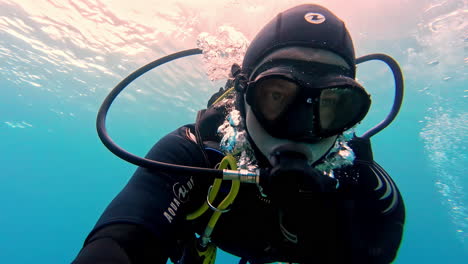 Underwater-face-view-of-snorkeler-exploring-aquatic-life-in-Greece