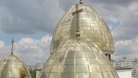 Dome-of-church,-aerial-view,-traditional-old-church-in-city-Lviv,-Ukraine,-cloudy-sky-background