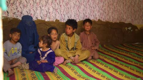 A-poor-Afghan-family-with-children-and-a-newborn-and-widow,-living-in-a-bad-situation-and-looking-for-assistance,-Oprhan-in-need-with-family