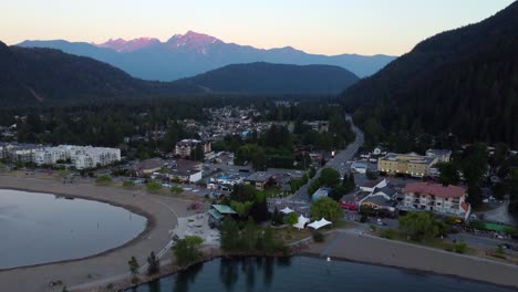 Harrison-Hot-Springs-town-and-lake-in-British-Columbia-at-sunset,-aerial-view