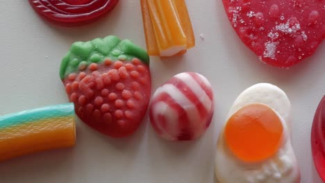 Very-close-from-above-panning-movement-of-jellies-on-a-table-in-studio-environment-at-home