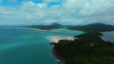 Hill-Inlet-Lookout-aerial-drone-view-Whitsundays-Island-North-end-Whitehaven-beach-QLD-Australia-Port-of-Airlie-National-Park-clear-turquoise-ocean-water-blue-sky-cloudy-boats-tourists-circle-right