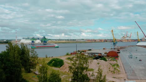 Cargo-ship-sailing-along-the-port.-Aerial-view