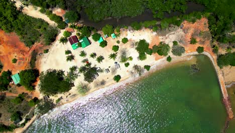 Cabo-Beach-Aerial-Ascending-Above-Coron-Sea-And-Beach-Homes-On-A-Beautiful-Day