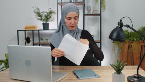 Muslim-woman-open-envelope-letter-feel-happy,-career-growth-advance-promotion,-bank-loan-approve