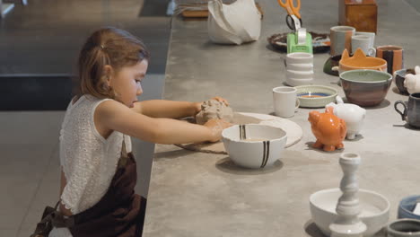 Female-Child-Creating-Pottery-At-Clay-Studio-In-Bali,-Indonesia