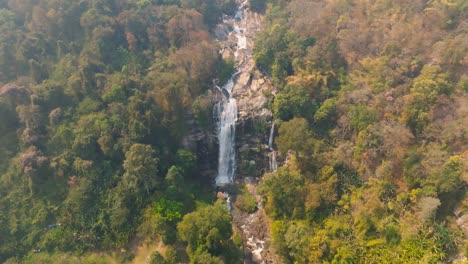 4K-aerial-drone-footage-of-Wachirathan-Waterfall,-Chiang-Mai,-Thailand,-Asia