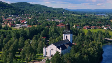 Aerial-view-of-church-of-tourist-resort-Järvsö,-Sweden-during-summer-sun